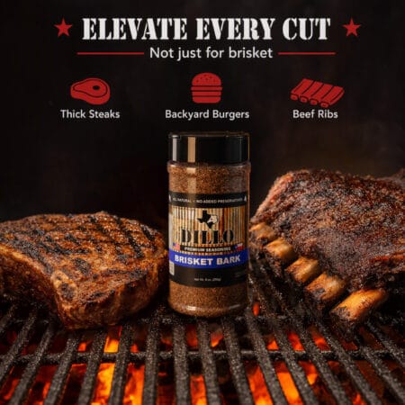 A bottle of Dillo Brisket Bark seasoning resting on a hot grill grate between a thick, seared steak and a rack of smoked beef ribs over open flames. The top text reads, "Elevate Every Cut. Not just for brisket," accompanied by icons for "Thick Steaks," "Backyard Burgers," and "Beef Ribs."