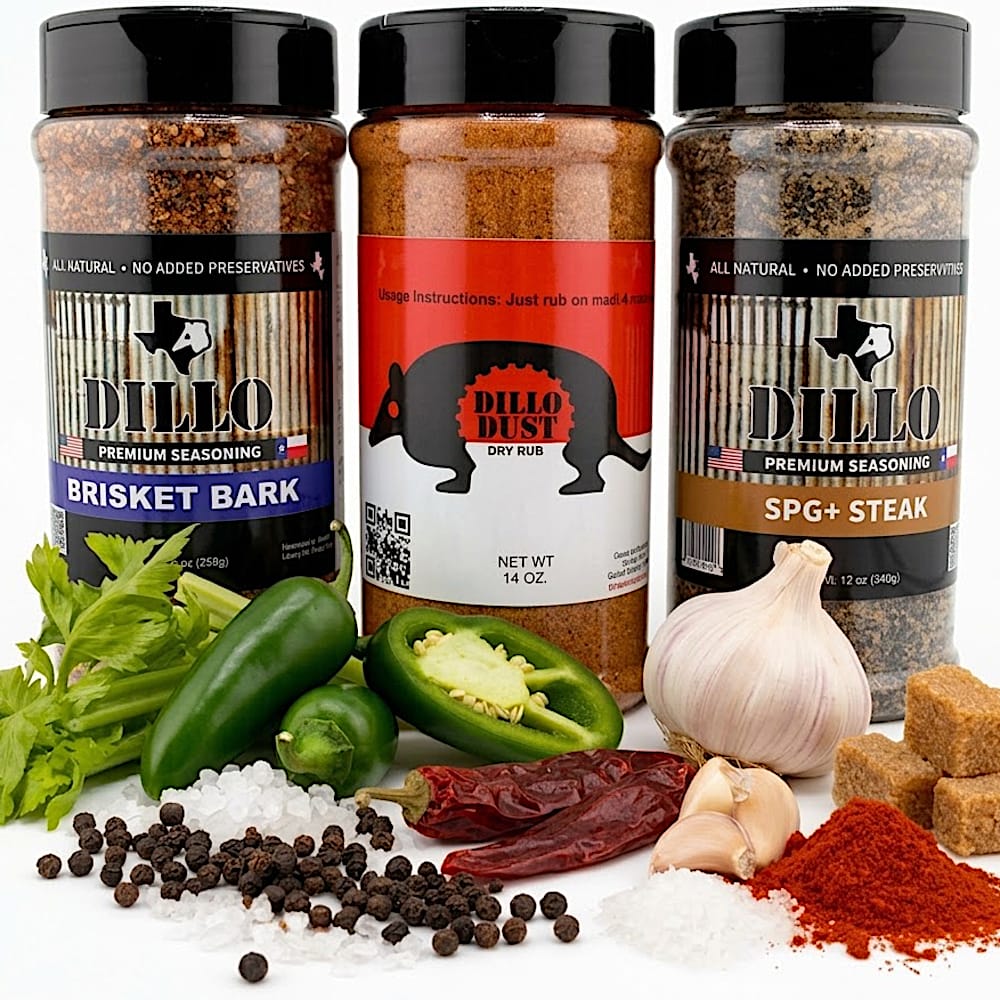 Three clear plastic spice shakers filled with BBQ seasoning rubs stand side by side against a solid black background. On the left is Brisket Bark Premium Seasoning (9 oz / 255g) with a dark blue label. In the center is Dillo Dust Dry Rub (14 oz) featuring a red and white label with an armadillo silhouette. On the right is SPG+ Steak Premium Seasoning (12 oz / 340g) with a tan label.